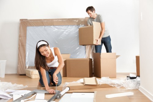 Local man with van loading items for a Greenwich move