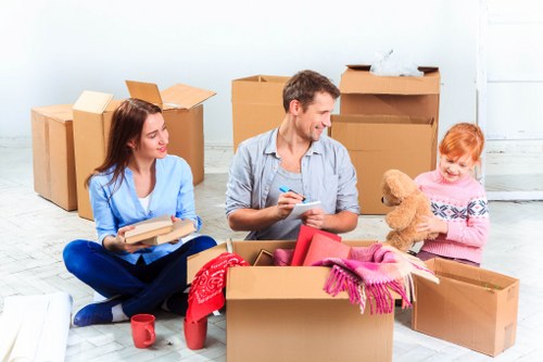 Local movers unloading office items at a Greenwich workplace