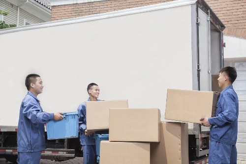 Removal team loading furniture for a Greenwich home relocation