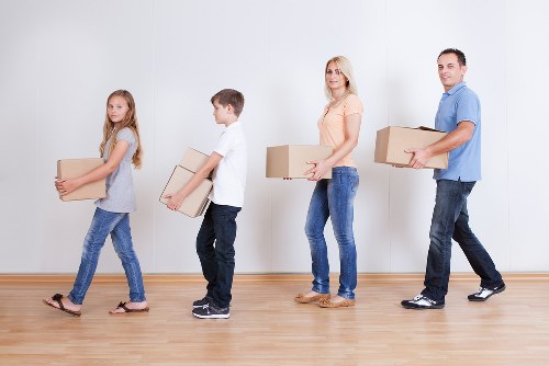 Professional movers loading household items for a Greenwich relocation